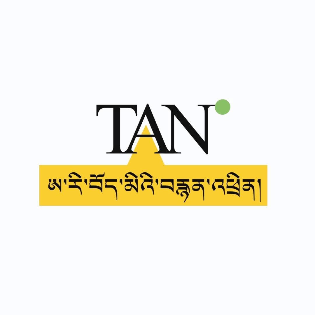 TAN logo with original Tibetan lettering